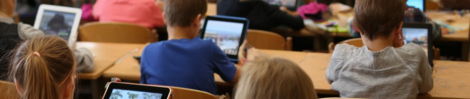 School children on tablets